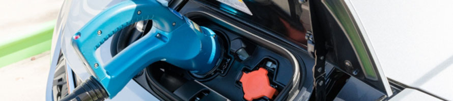 Electric car charging representing the battery industry and its battery cathode materials